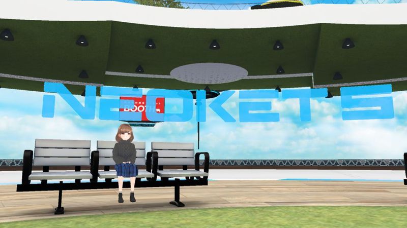 A girl sitting on a bench, with the NEOKET5 logo behind her.